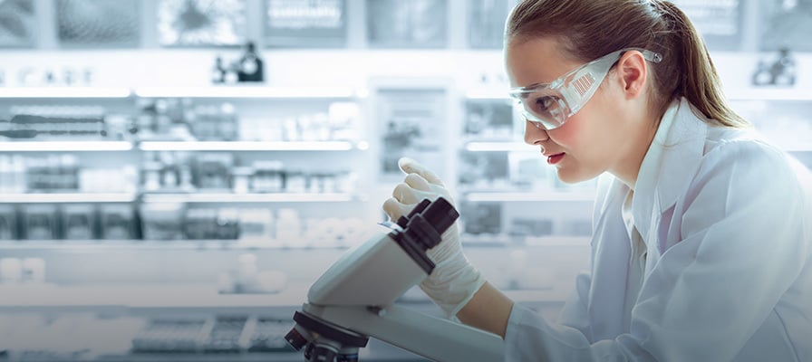 Pathologist working with a microscope Pathologist working with a microscope
